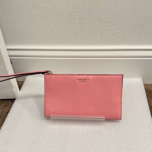 kate spade Handbags - kate spade pink leather wristlet wallet with gold-tone logo